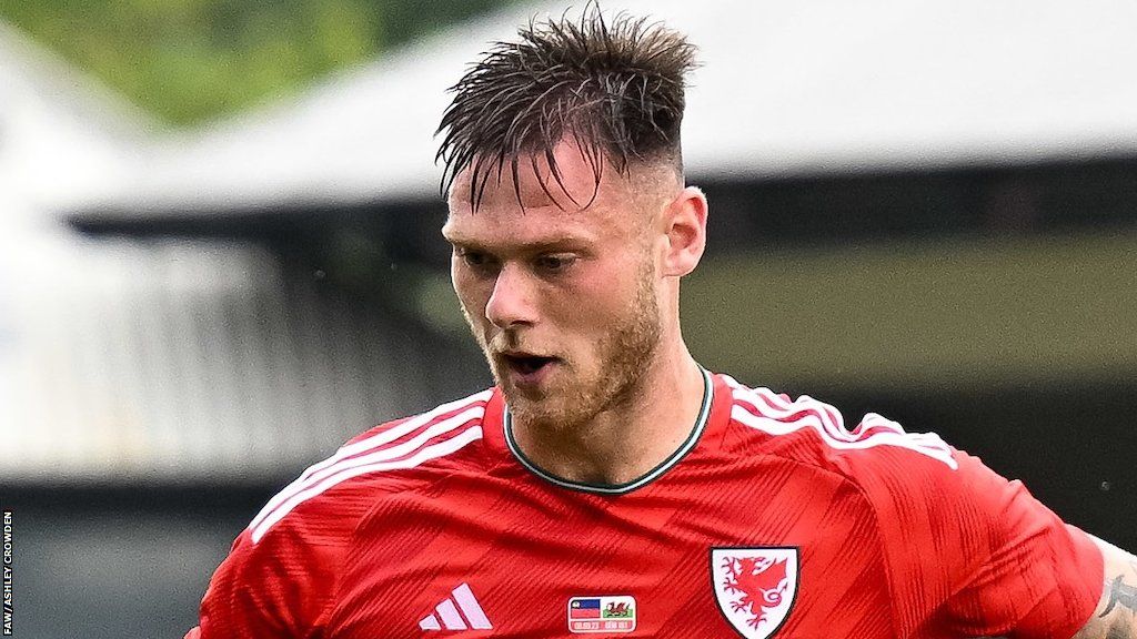 Joe Low in action for Wales Under-21s