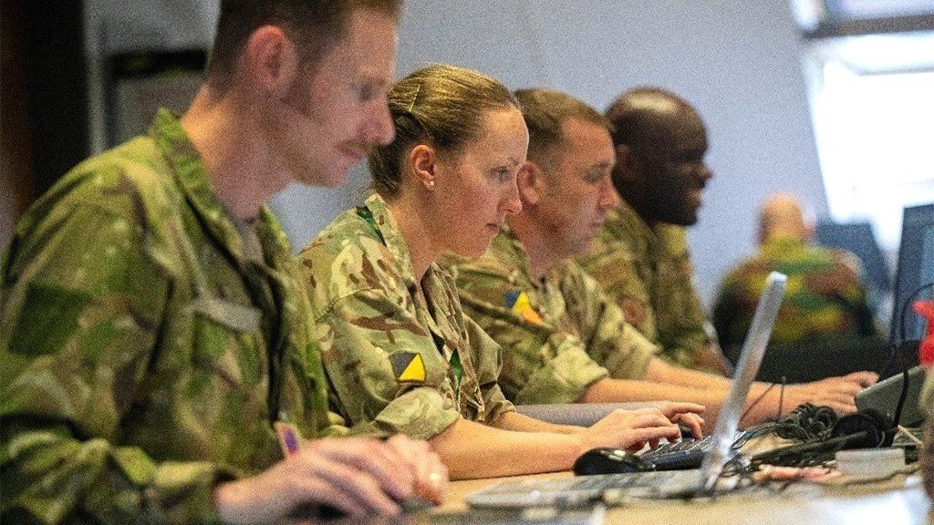 EUCOM Control Center – Ukraine / International Donor Coordination Centre staff members from the United Kingdom and United States, Patch Barracks, Germany, 3 June 2022