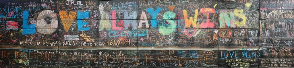 A wall is covered with chalk writing outside city hall as an informal memorial August 14, 2017 in Charlottesville, Virginia