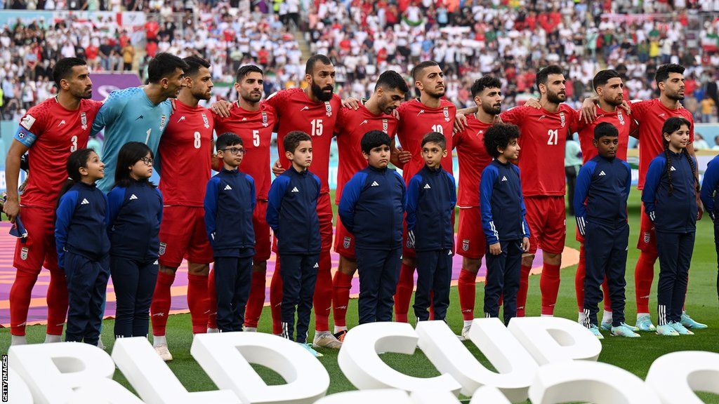 The Iran players lining up for the national anthem