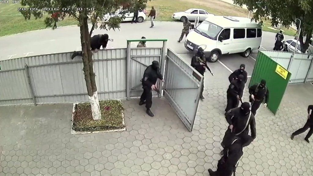 masked men with guns entering property