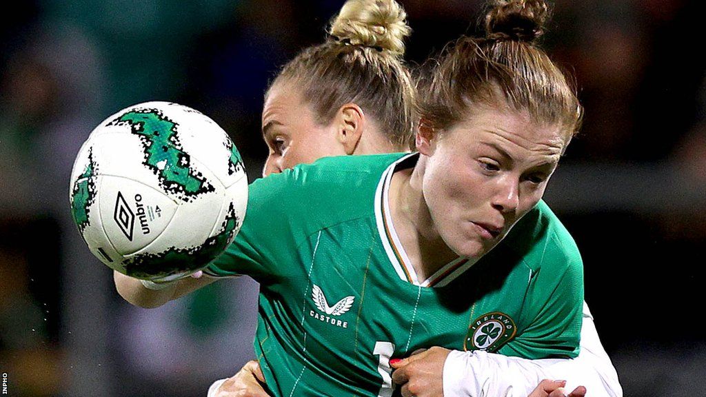 Emily Murphy in action for the Republic of Ireland against Wales' Rhiannon Roberts