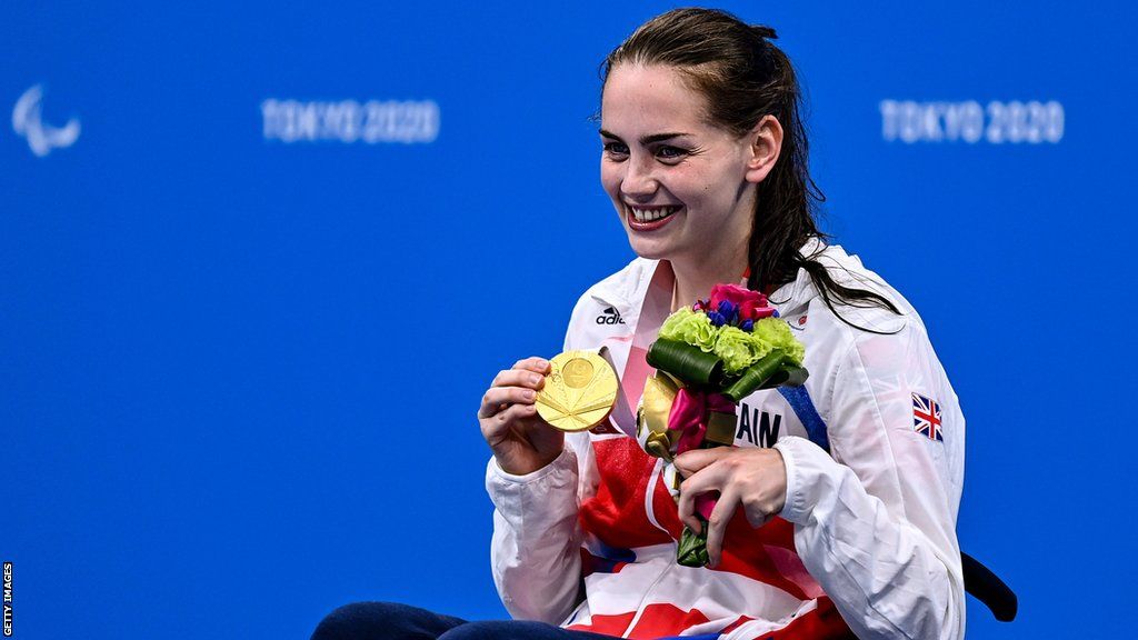Tully Kearney of Great Britain, with her gold medal after winning the Women's S5 100 metre freestyle final at the Tokyo Paralympic