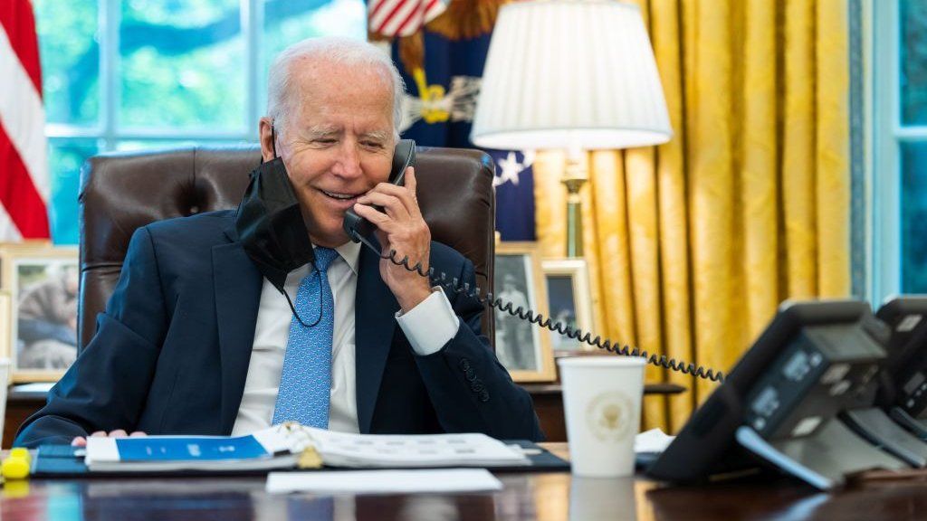 President Biden making a call in the oval office