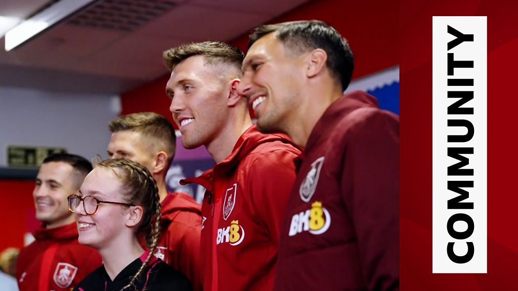 Burnley players pose with local service users