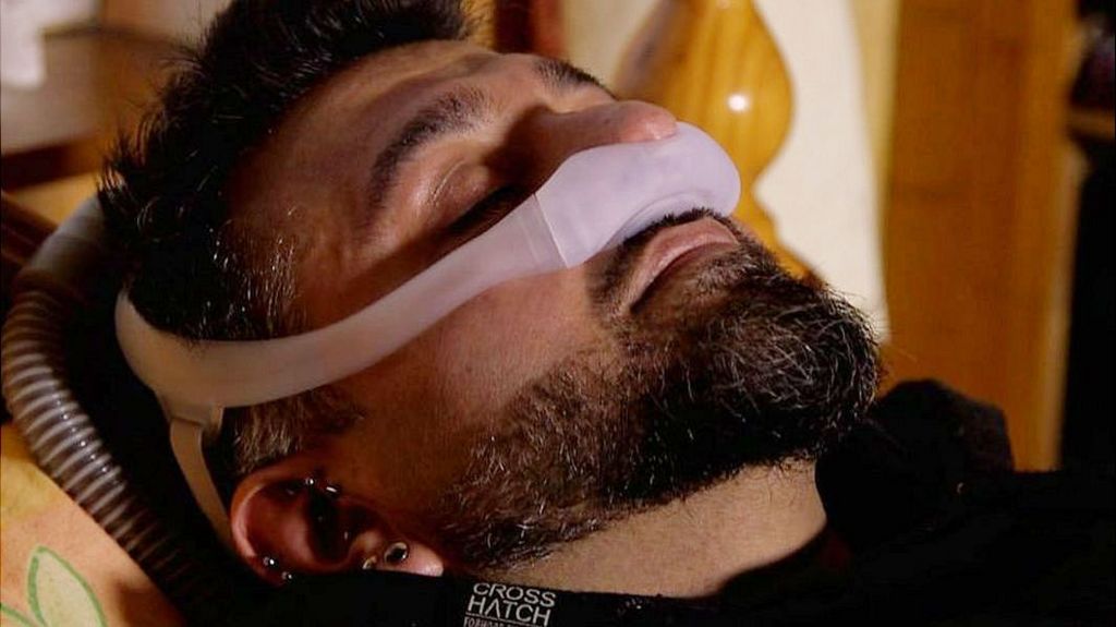 Mohammed, who suffers from sleep apnoea, wearing his sleep machine