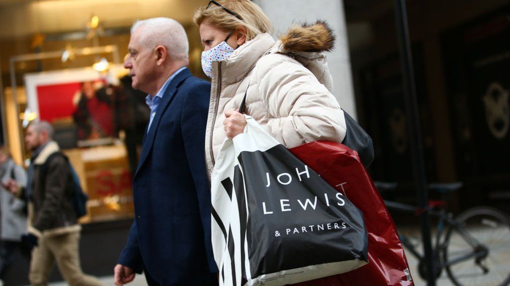 Woman carrying John Lewis bag