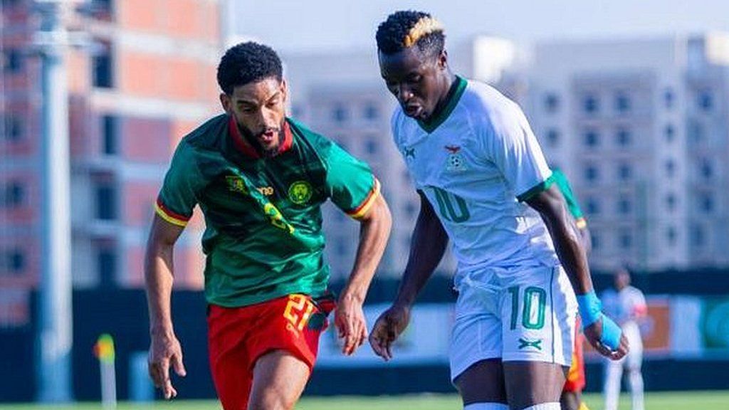 Zambia forward Fashion Sakala (right) in action for his country against Cameroon