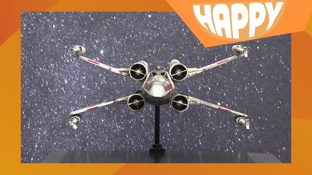 A star wars x-wing and the happy logo