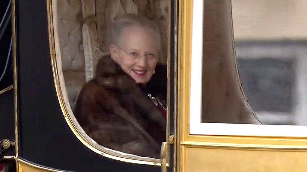 Queen Margrethe sitting in gold carriage