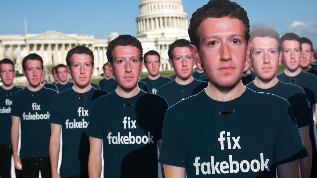 Cardboard cutouts of Mark Zuckerberg at a demonstration outside the US Capitol building in April 2018