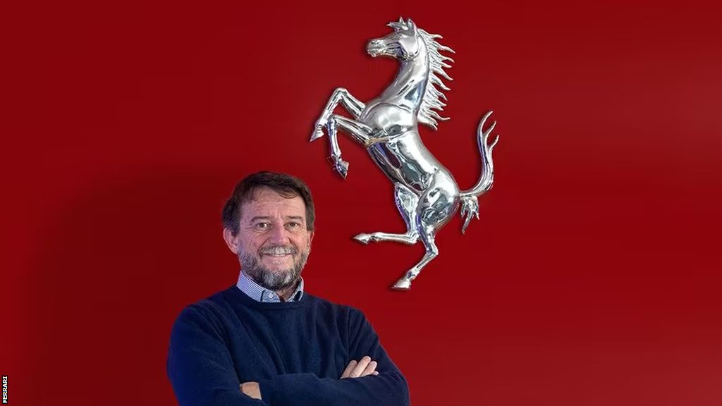Giovanni Soldini with Ferrari logo