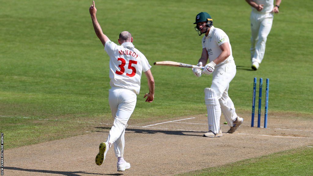Jamie McIlroy of Glamorgan celebrates bowling Worcestershire tail-ender Matthew Waite