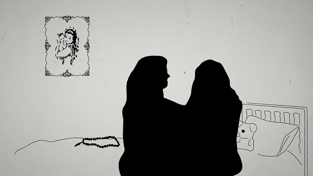 Silhouette of two women hugging