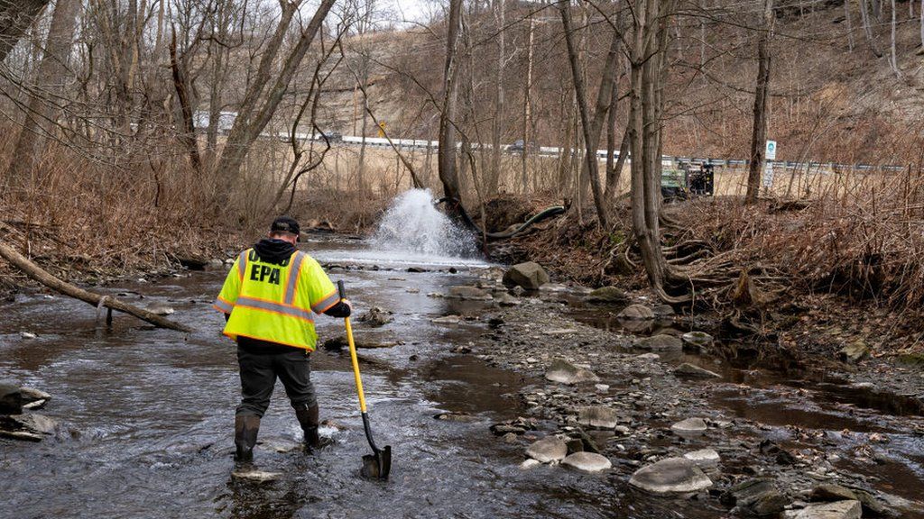 Officials examining the water