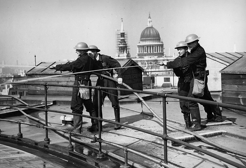 Auxiliary Fire Brigade hose drill on the roof of the Bank of England, WW2