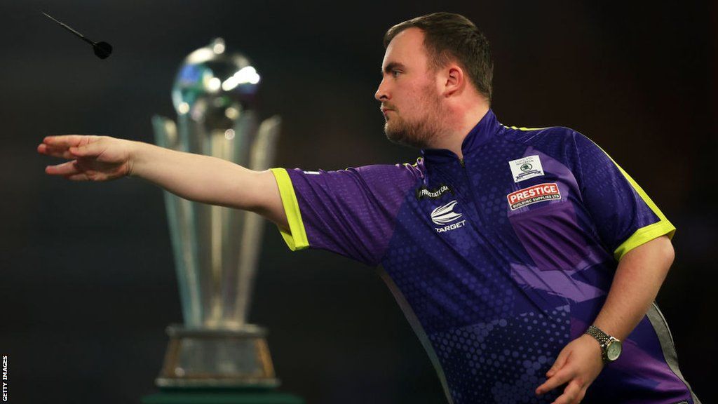 Luke Littler throws a dart at the PDC World Darts Championship final in January 2024