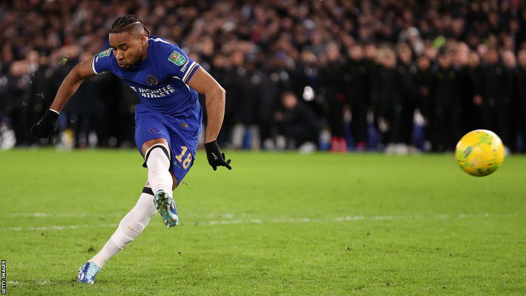 Chelsea's Christopher Nkunku scores his penalty in the shootout