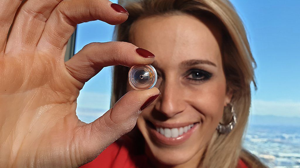 Click's Lara Lewington holding a Mojo Vision contact lens