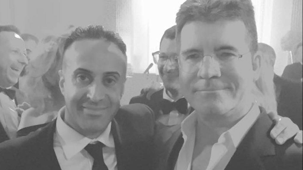 Manni Hussain grabbing a picture with Simon Cowell