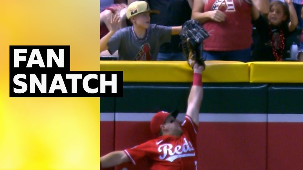 Kid in crowd steals baseball from catcher