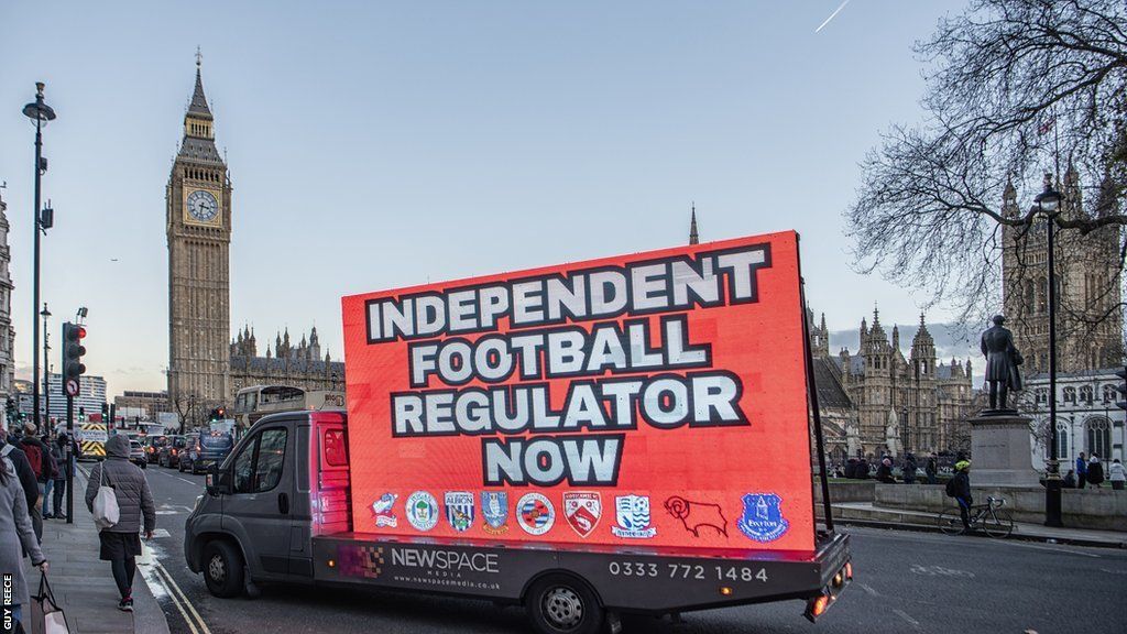 A screen on a lorry in front of Big Ben asking for an Independent Football regulator