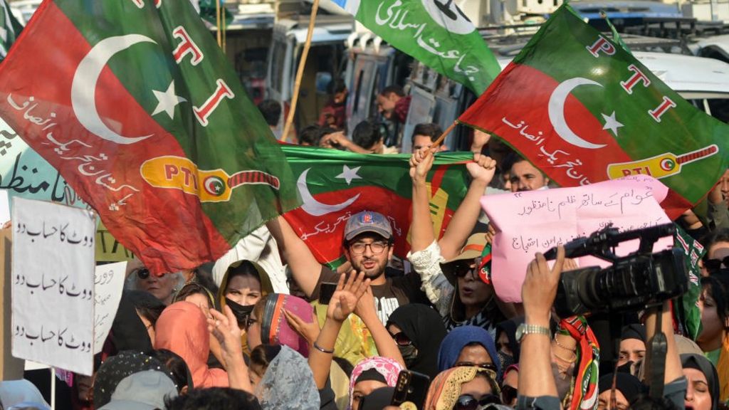 Supporters of the PTI party protest outside an election commission office in Karachi on February 10, 2024