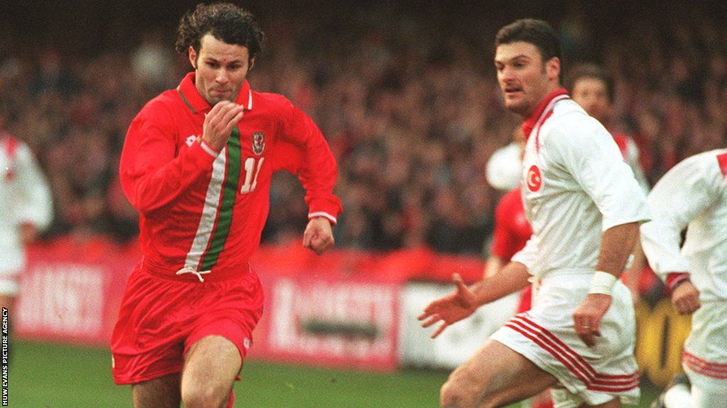Wales' Ryan Giggs (left) takes on Alpay of Turkey in 1996