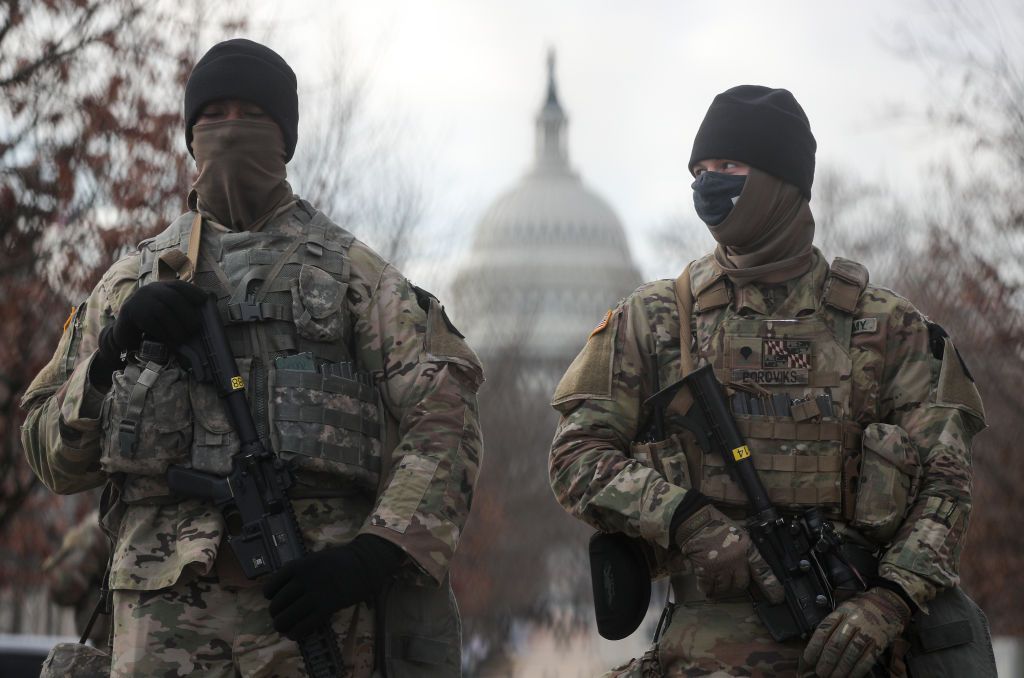 US National Guardsmen stand on a closed street outside the Capitol Building