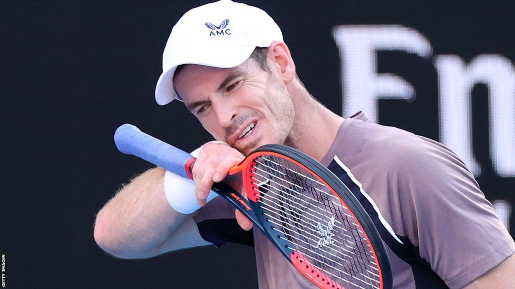 Andy Murray wipes his face at the 2024 Australian Open