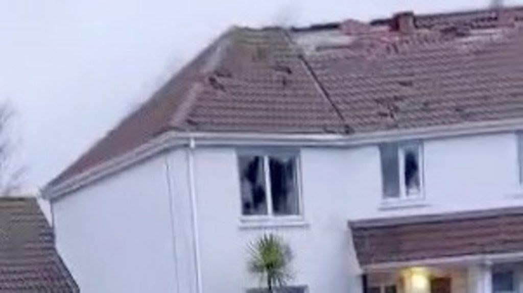 Destroyed roof and smashed window