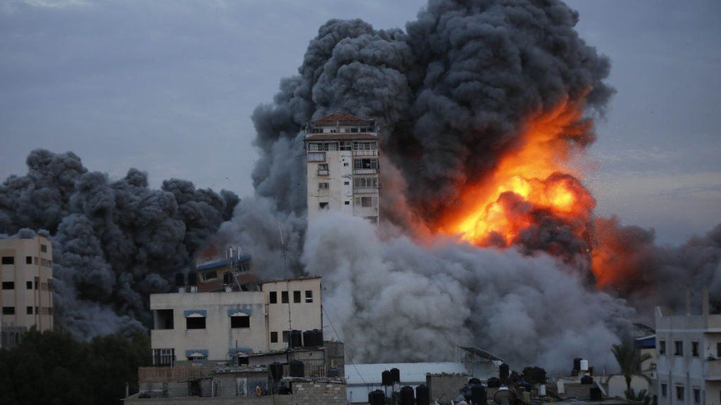 Smoke and flame rise after Israeli air forces targeting a shopping center in Gaza Strip, Gaza on October 07, 2023.