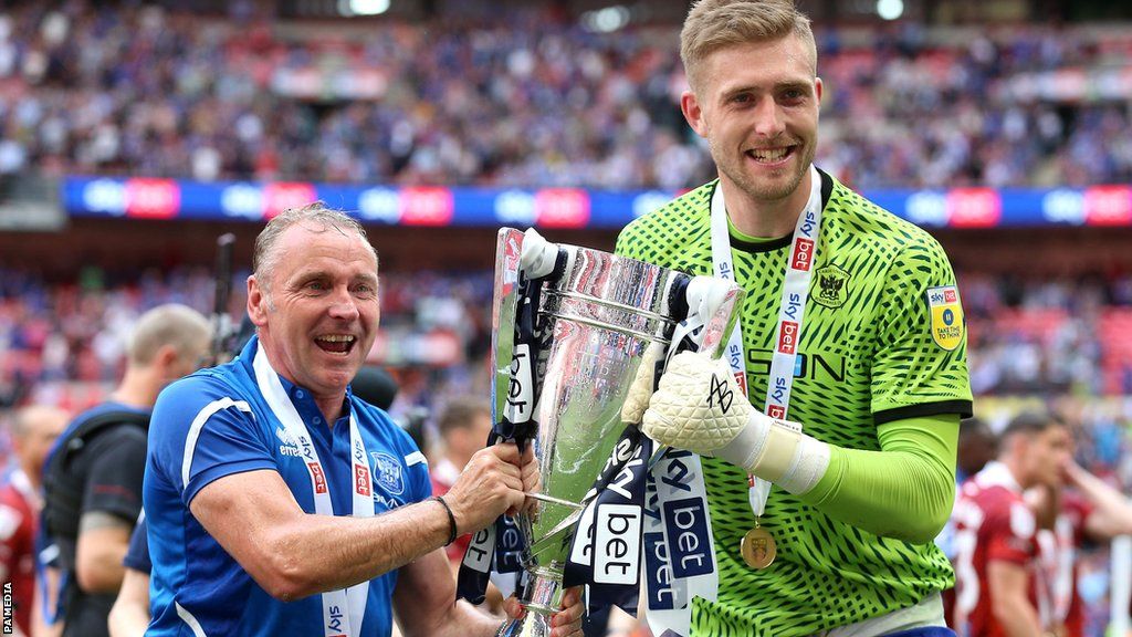 Paul Simpson and Tomas Holy with the League Two play-off trophy