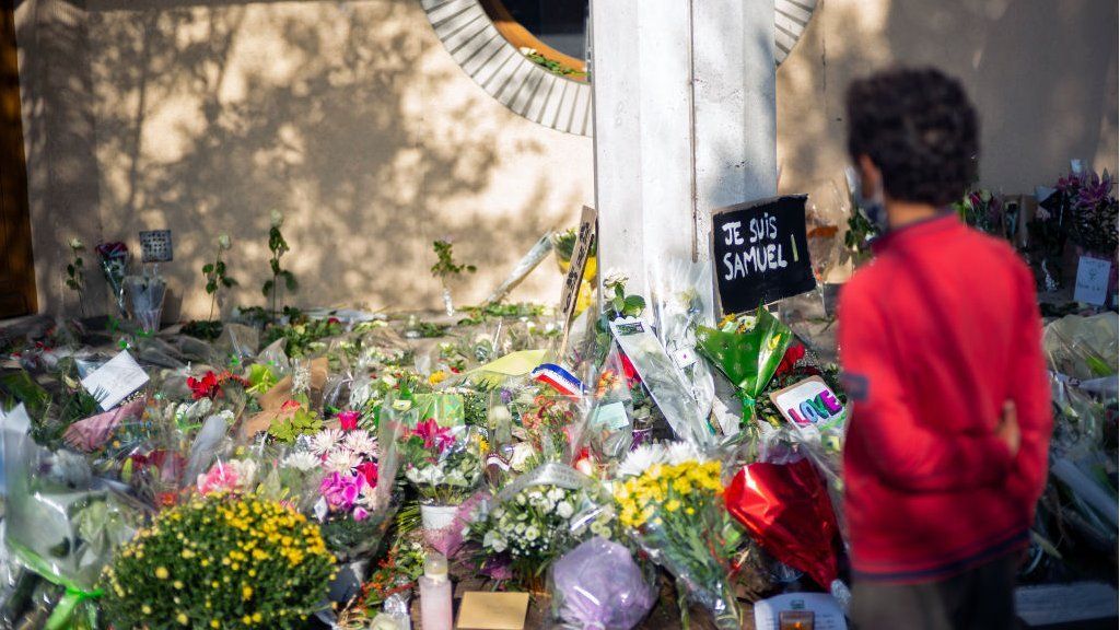 Flowers at a vigil for Mr Paty in Paris, France