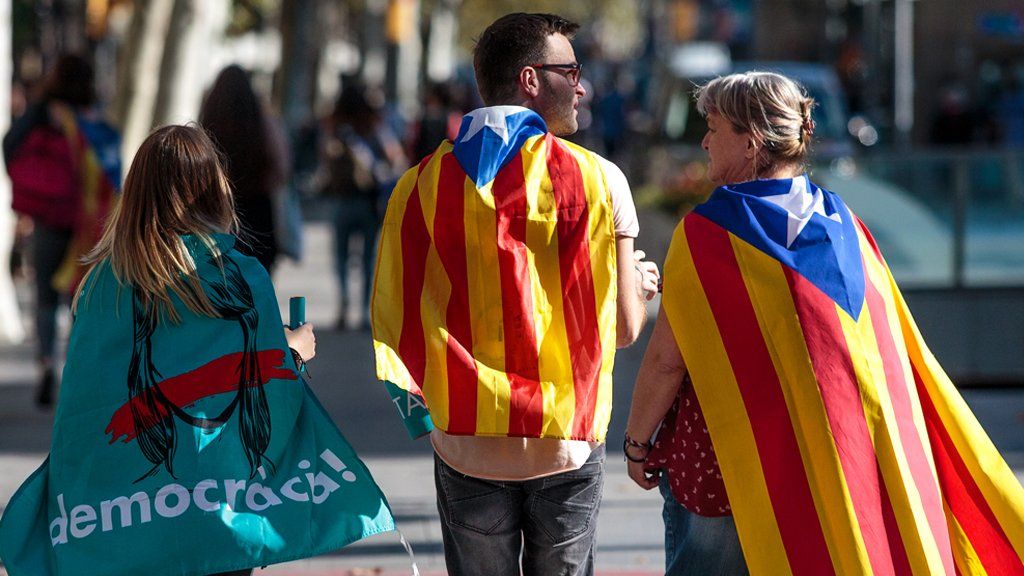 Protesters gather in the city center to demonstrate against the Spanish federal government;s move to suspend Catalonian autonomy