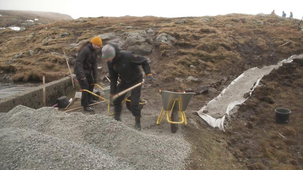 Voluntourists rebuild a walking path popular with Faroese farmers