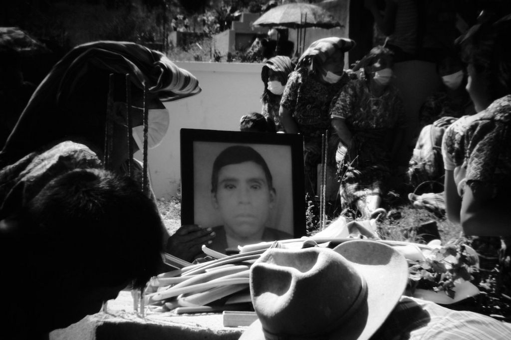 Friends and family members of Baltazar Gomez Toma bury his remains in Cotzal's main cemetery nearly 40 years after his disappearance. Cotzal, Quiche, Guatemala. February 11, 2021.
