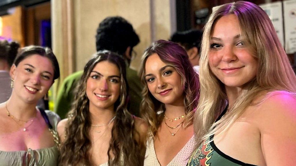 Four women outside a bar