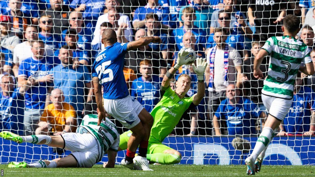 Rangers' Kemar Roofe fires past Celtic goalkeeper Joe Hart