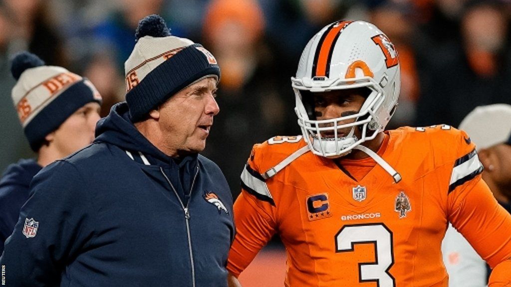 Denver Broncos head coach Sean Payton talks with quarterback Russell Wilson