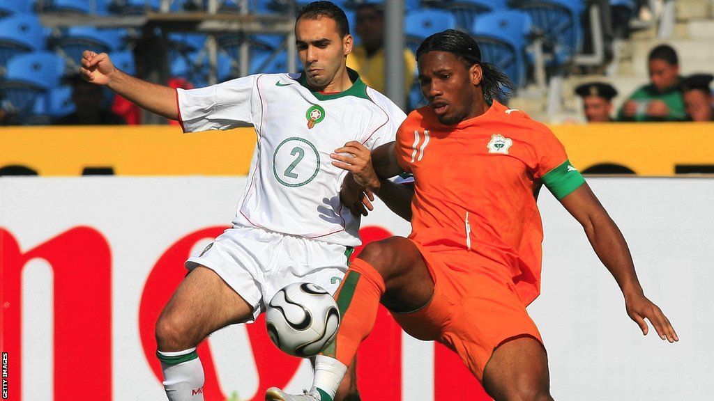 Walid Regragui of Morocco takes on Didier Drogba of Ivory Coast