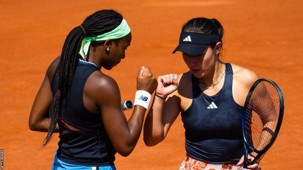 Coco Gauff and Jessica Pegula celebrate winning a point during their French Open match