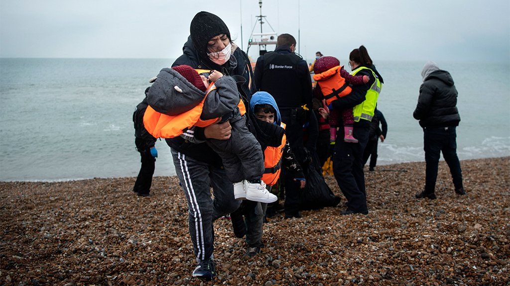 Migrants on a beach in Dungeness, 24 November 2021