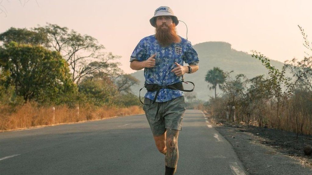 Russell Cook running in Africa