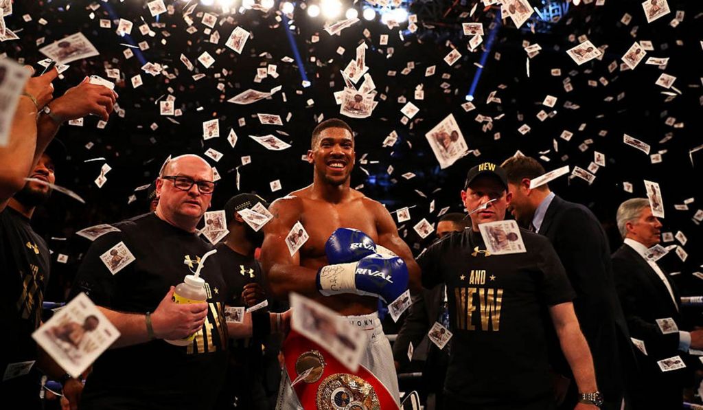 Anthony Joshua celebrates after defeating Charles Martin in April 2016