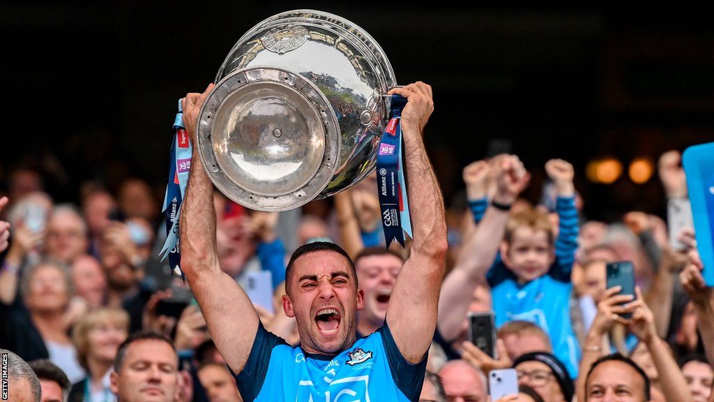 Dublin captain James McCarthy lifts the Sam Maguire Cup