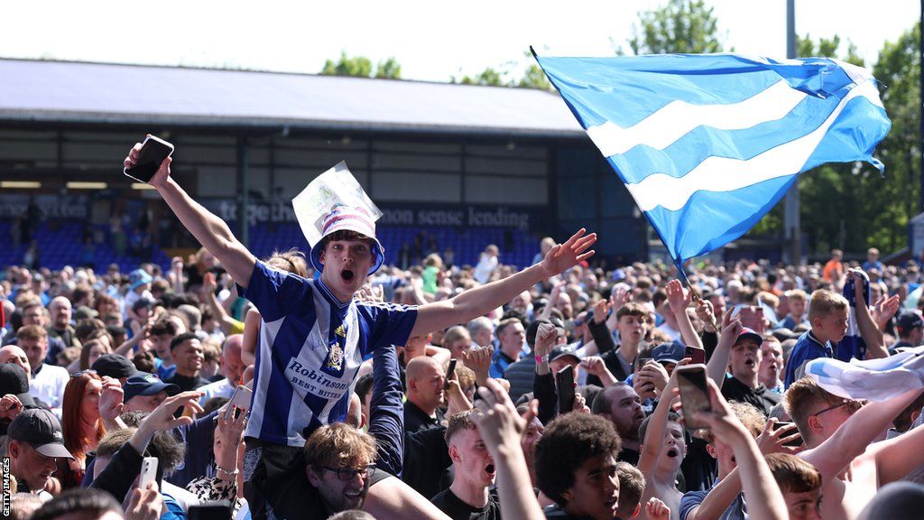 Stockport fans celebrate their team's play-off semi-final win over Salford City