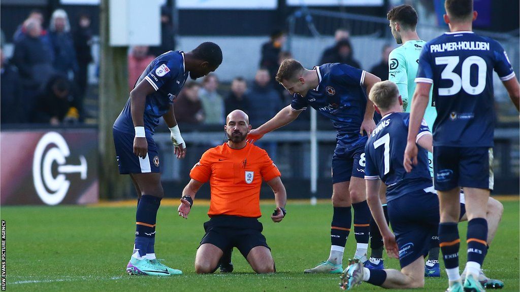 Referee Darren Drysdale needed attention during the game after a collision with a player