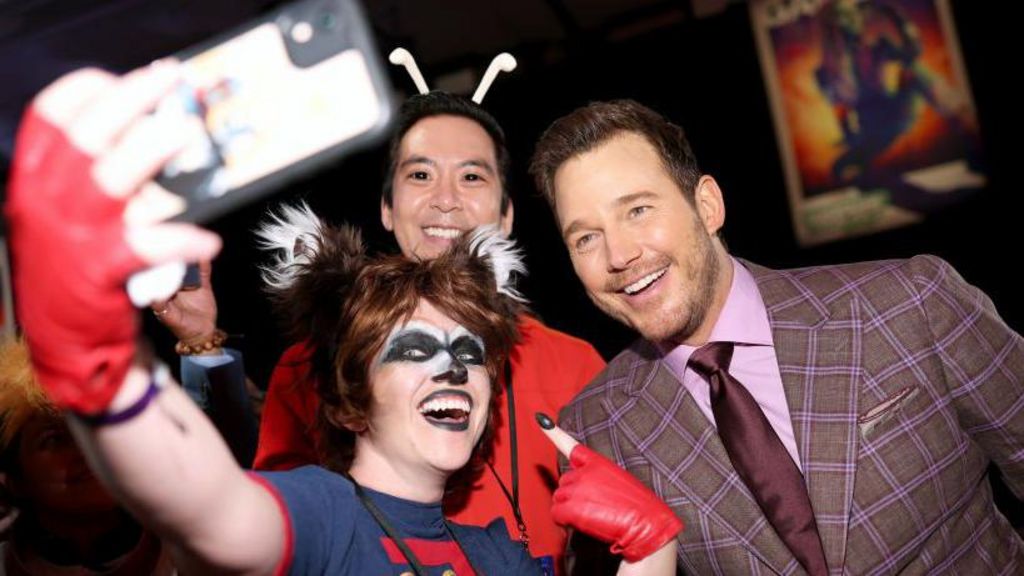 Guardians of the Galaxy fans dressed in costumes of characters from the film with Chris Pratt at the premiere of the third film - they are taking a selfie
