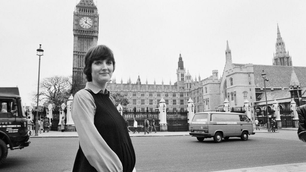 Harriet Harman standing outside the Houses of Parliament while pregnant in 1982